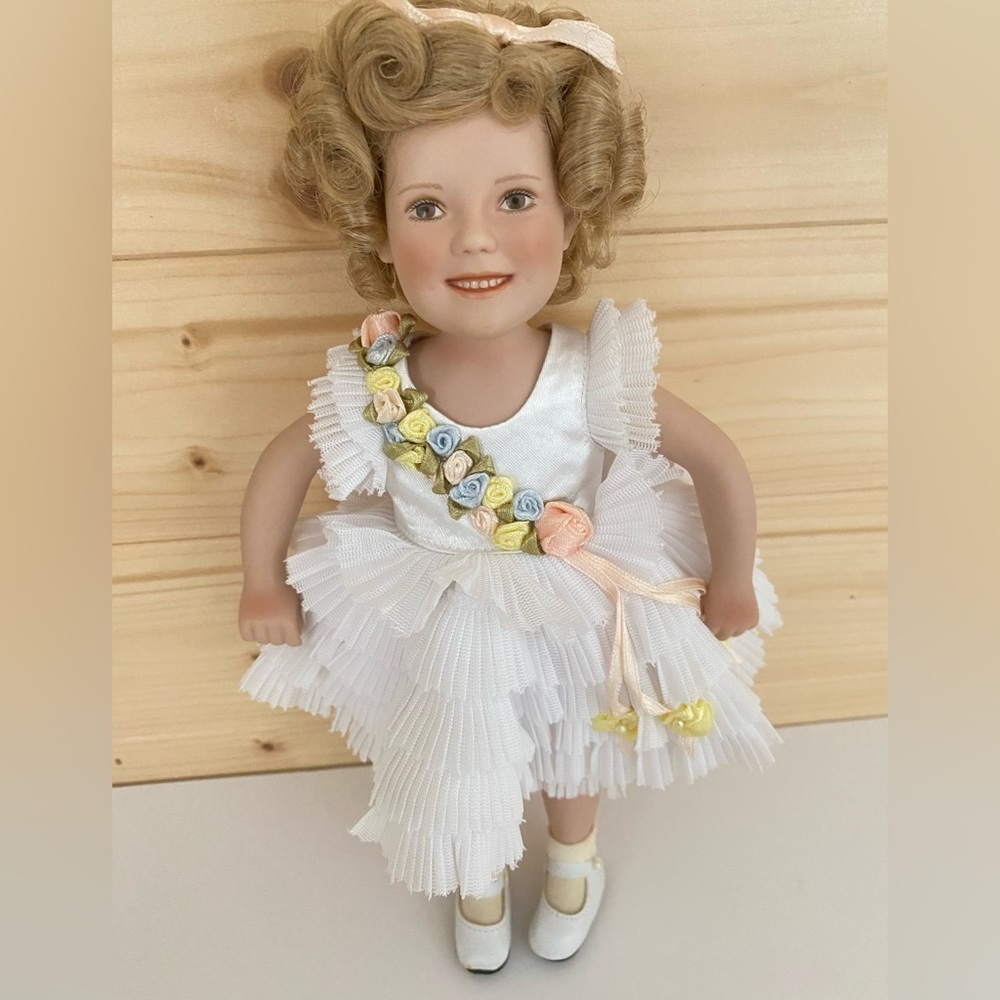 MBI Porcelain Shirley Temple 10” Doll “Baby Take a Bow” Ruffled White Dress